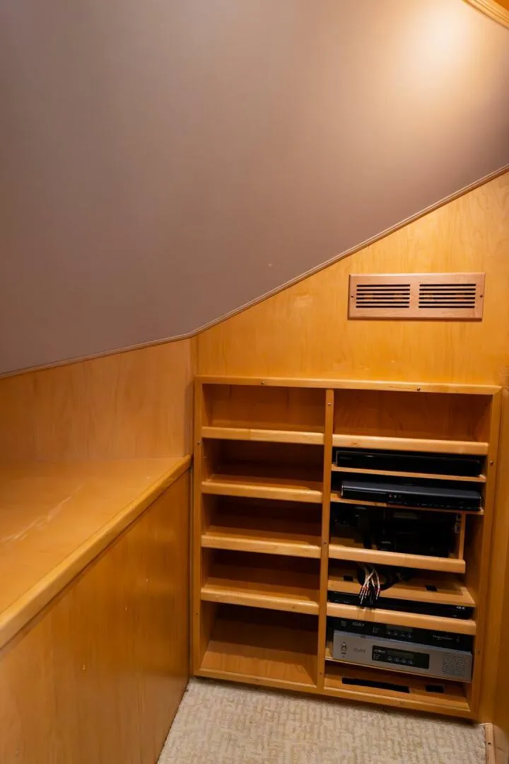 Slide: The Image of Viking 76 Convertible 2015 yacht interior with wooden shelving and electronic equipment. - 40