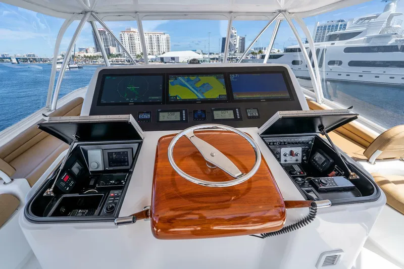 Slide: The Image of Luxurious 2015 Viking 76 Convertible yacht helm with advanced navigation systems. - 43