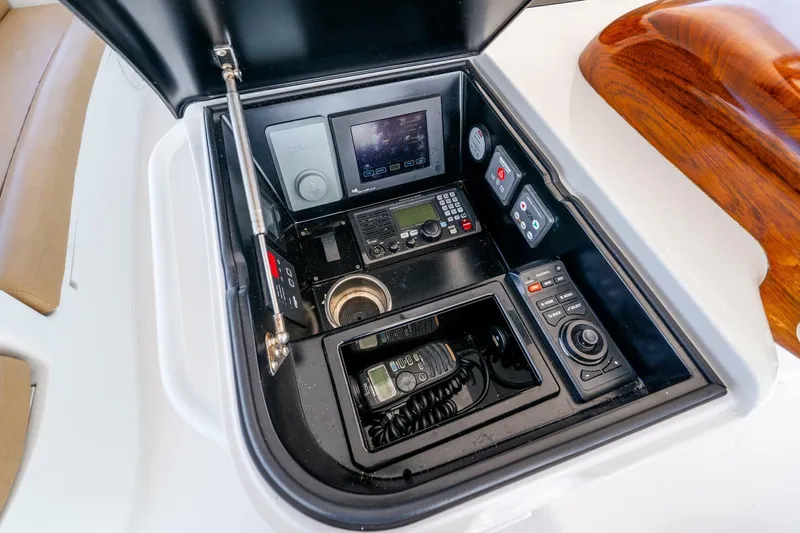 Slide: The Image of Control panel of 2015 Viking 76 Convertible yacht with navigation and communication equipment. - 48