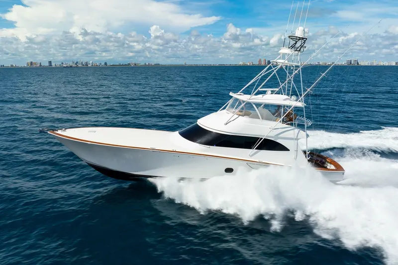 Slide: The Image of 2015 Viking 76 Convertible yacht cruising on open ocean. - 5