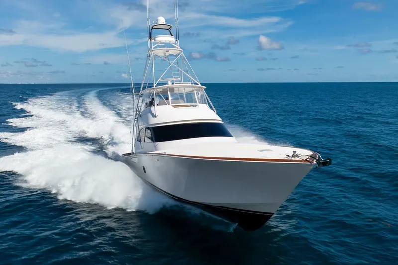 Slide: The Image of 2015 Viking 76 Convertible yacht cruising on open ocean waters. - 6