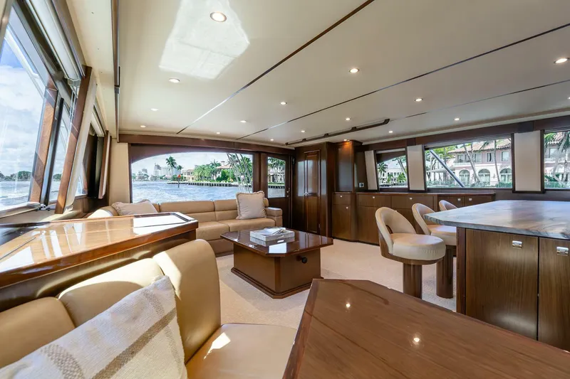Slide: The Image of Luxurious interior of 2015 Viking 76 Convertible yacht with elegant seating and panoramic windows. - 9