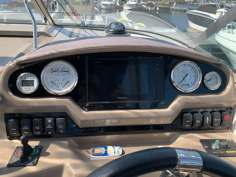 Slide: The Image of Dashboard of 2018 Regal 28 Express boat with gauges and controls. - 12