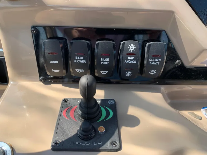 Slide: The Image of Control panel of 2018 Regal 28 Express boat with switches and joystick. - 15