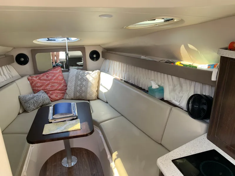 Slide: The Image of 2018 Regal 28 Express cabin interior with cozy seating and modern decor. - 20