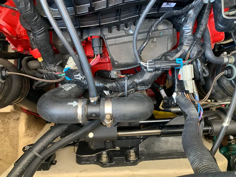 Slide: The Image of Engine compartment of a 2018 Regal 28 Express boat, showcasing wiring and components. - 33