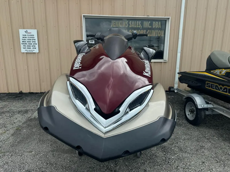 Slide: The Image of 2011 Kawasaki Ultra 310LX jet ski displayed at dealership. - 2