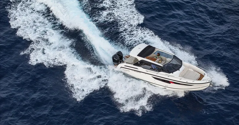 Slide: The Image of 2024 Skamander Sorrento boat cruising on open water, aerial view. - 10