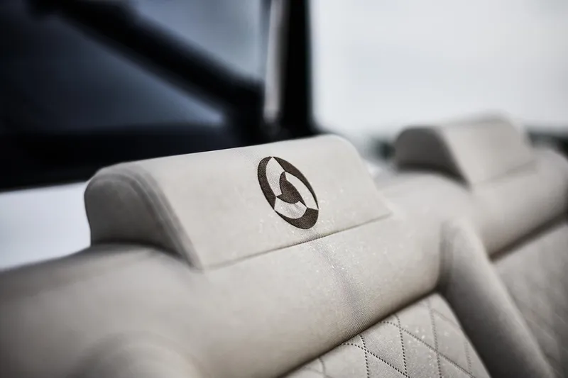 Slide: The Image of 2024 Skamander Sorrento interior with embroidered logo on beige headrest. - 20