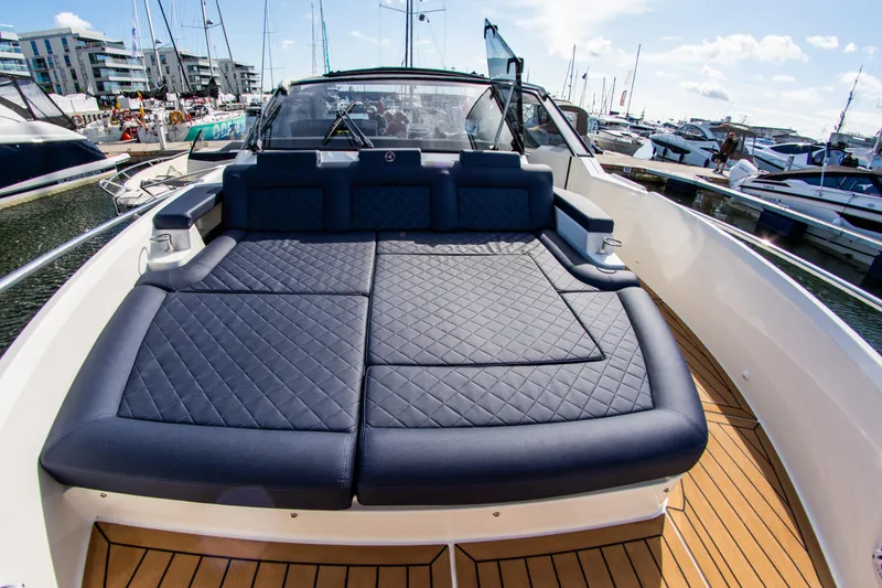 Slide: The Image of 2024 Skamander Sorrento yacht with spacious sunbathing deck, docked at marina. - 23