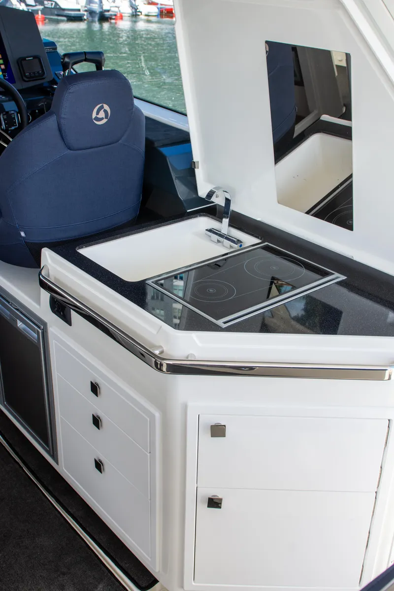 Slide: The Image of 2024 Skamander Sorrento yacht interior with modern kitchenette and sleek design. - 32
