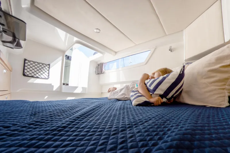 Slide: The Image of 2024 Skamander Sorrento cabin interior with cozy bed and natural light. - 38