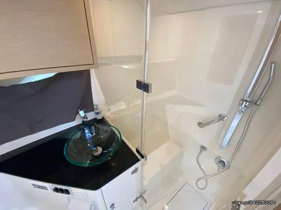 Slide: The Image of 2024 Skamander Sorrento bathroom with glass sink and modern shower. - 44