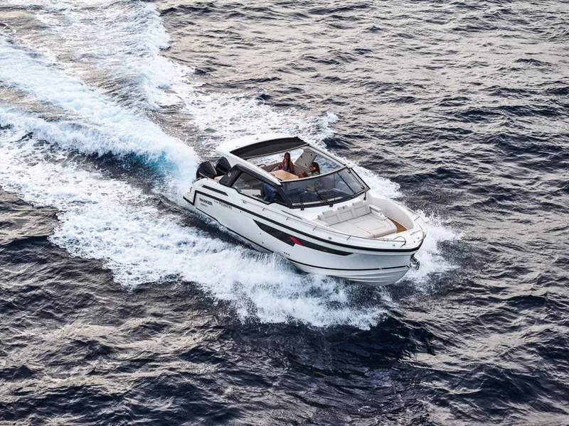 Slide: The Image of 2024 Skamander Sorrento boat cruising on open water, creating a wake. - 8