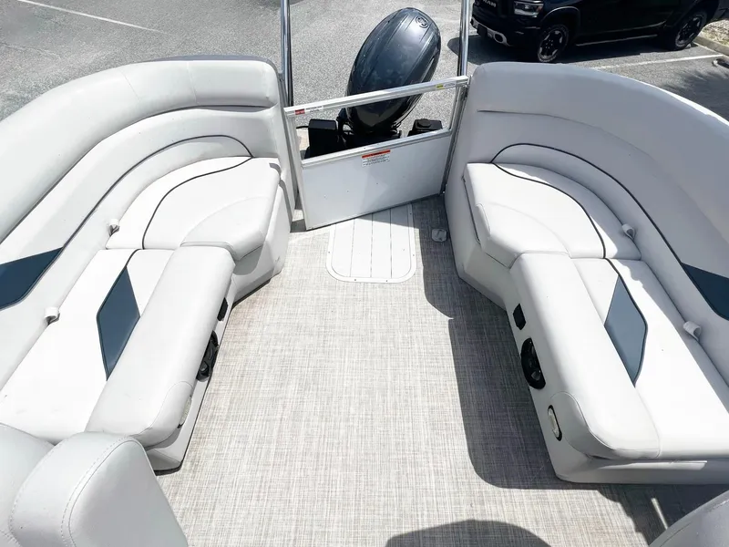 Slide: The Image of 2021 SunCatcher Select 20RC pontoon boat interior with plush seating and modern design. - 2