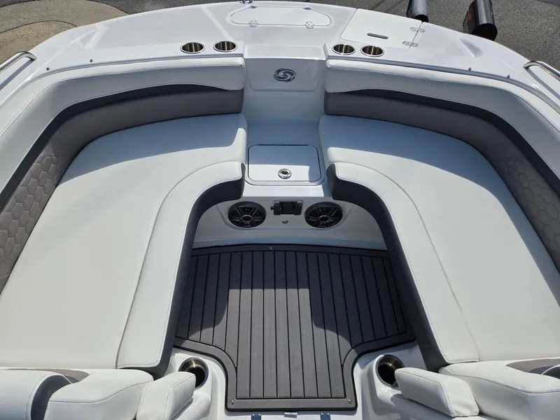 Slide: The Image of 2025 Hurricane SunDeck Sport 192 RL OB boat interior with cushioned seating and cup holders. - 10
