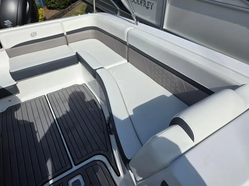 Slide: The Image of 2025 Hurricane SunDeck Sport 192 RL OB boat interior with cushioned seating and sleek design. - 11
