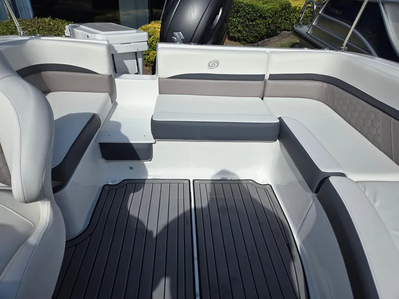 Slide: The Image of 2025 Hurricane SunDeck Sport 192 RL OB boat interior with cushioned seating and sleek flooring. - 13