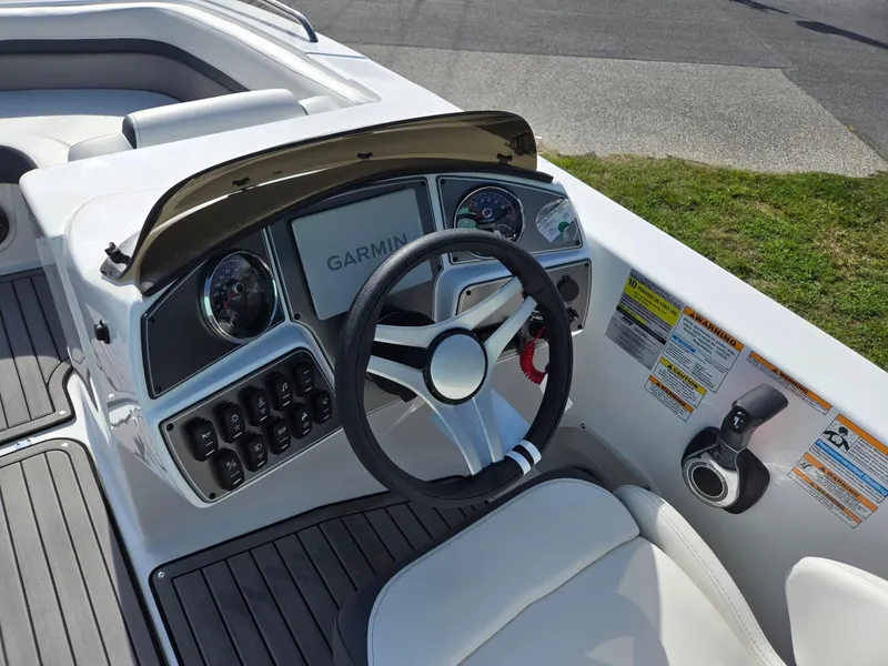 Slide: The Image of 2025 Hurricane SunDeck Sport 192 RL OB boat dashboard with Garmin navigation system. - 15