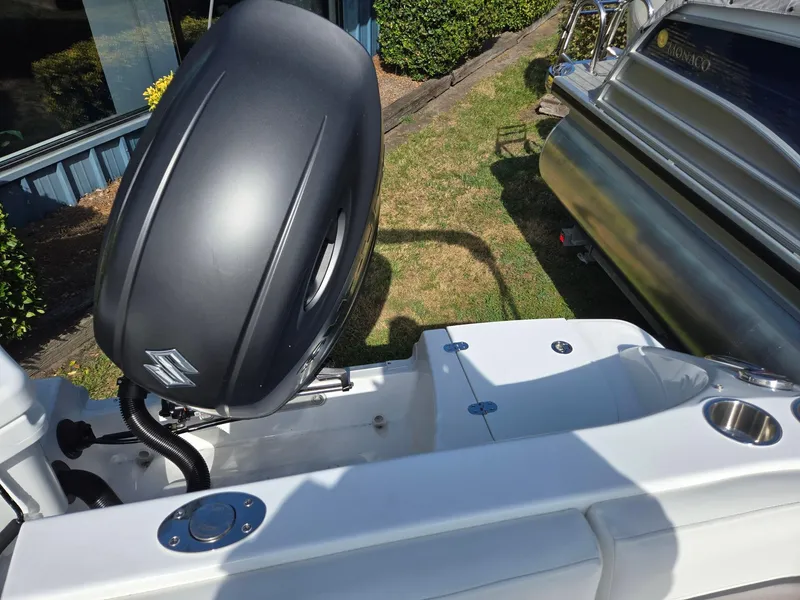 Slide: The Image of 2025 Hurricane SunDeck Sport 192 RL OB boat with Suzuki outboard motor. - 23