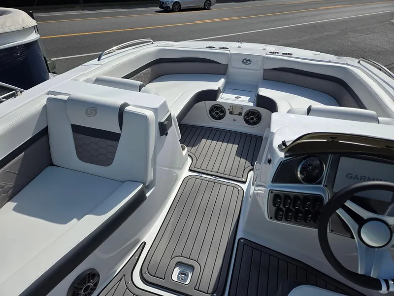 Slide: The Image of 2025 Hurricane SunDeck Sport 192 RL OB boat interior with modern seating and dashboard. - 24