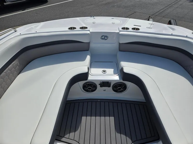 Slide: The Image of 2025 Hurricane SunDeck Sport 192 RL OB boat interior with seating and speakers. - 6
