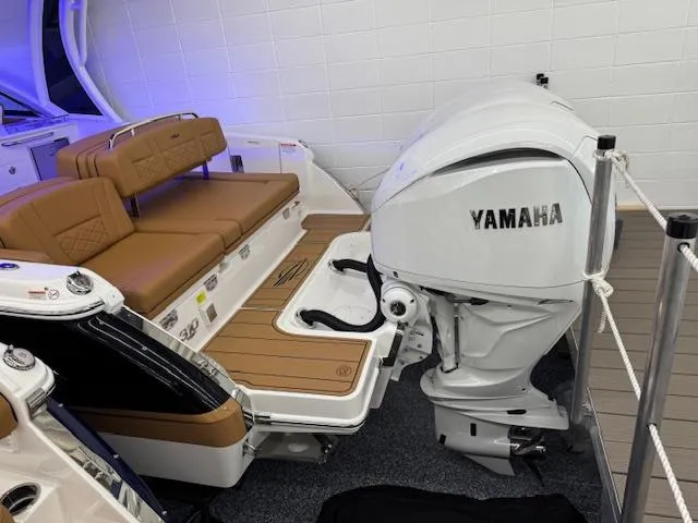 Slide: The Image of 2025 Chaparral 310 OSX boat with Yamaha outboard engine and tan seating. - 27