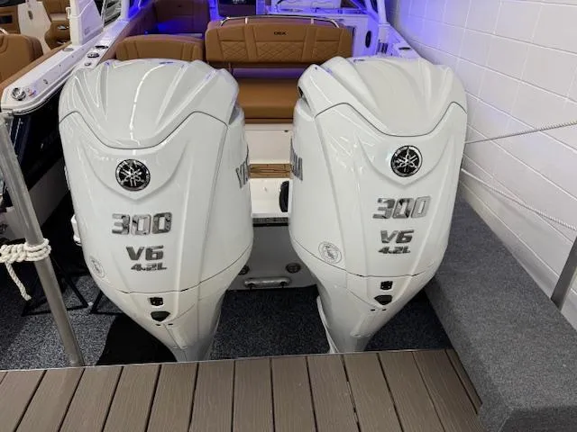 Slide: The Image of 2025 Chaparral 310 OSX with twin Yamaha 300 V6 outboard engines. - 28