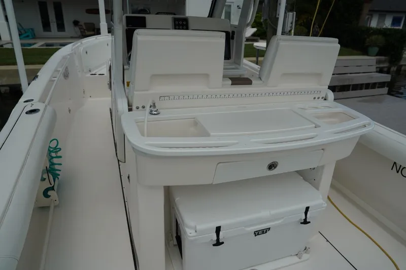 Slide: The Image of 2011 Everglades 295 boat interior with seating and storage compartments. - 15