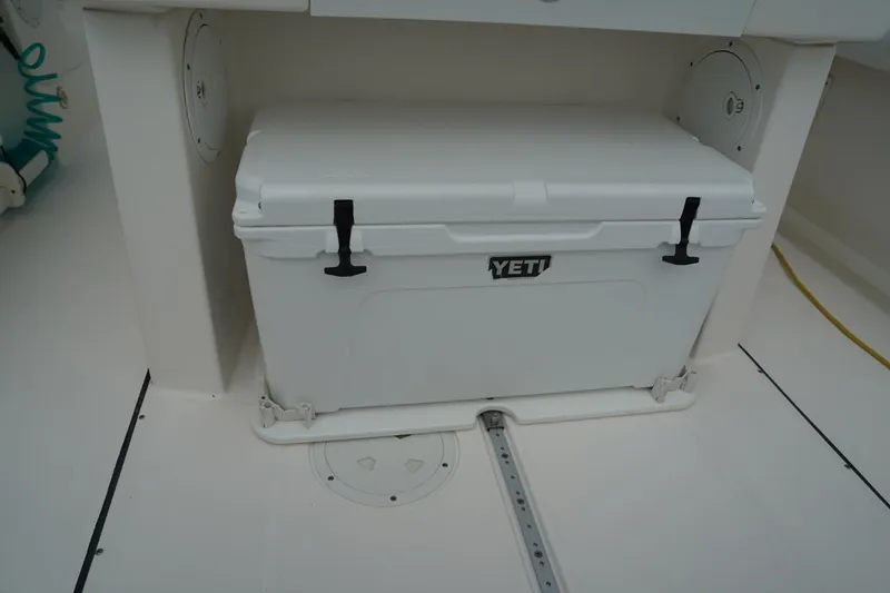 Slide: The Image of YETI cooler on 2011 Everglades 295 boat deck, secured with latches. - 16