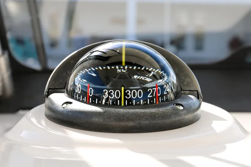 Slide: The Image of Close-up of a boat compass on a 2011 Everglades 295. - 19