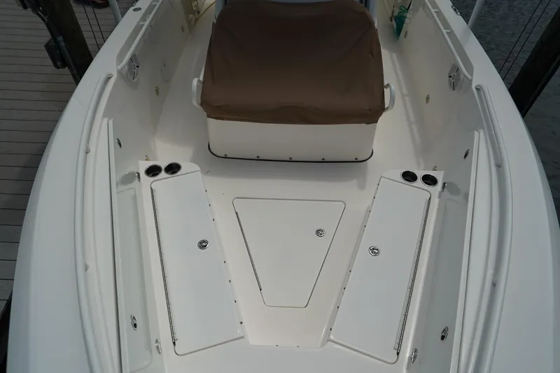 Slide: The Image of 2011 Everglades 295 boat interior with seating and storage compartments. - 24