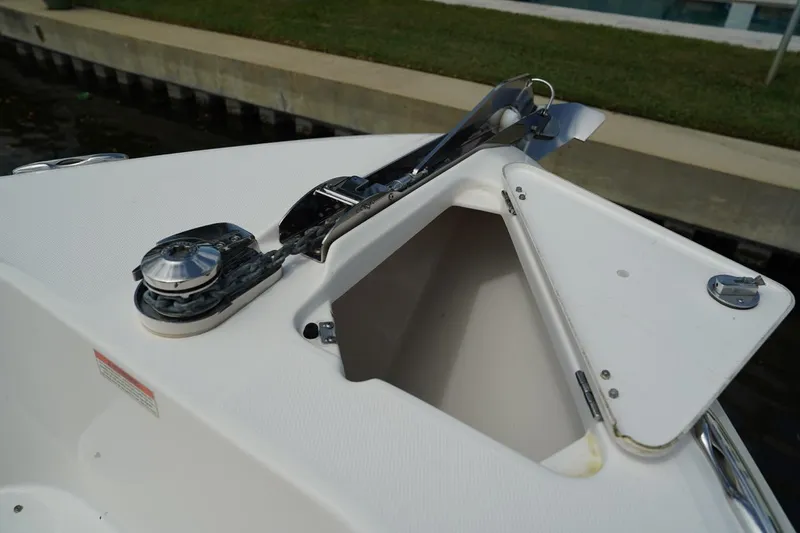Slide: The Image of 2011 Everglades 295 boat anchor compartment with open hatch. - 27