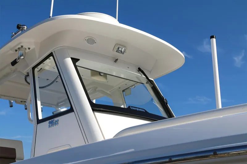 Slide: The Image of Everglades 295 boat, 2011 model, featuring sleek design and modern cockpit against blue sky. - 31