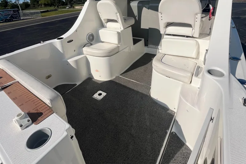 Slide: The Image of 2011 Bayliner 266 Discovery boat interior with seating and carpeted floor. - 9