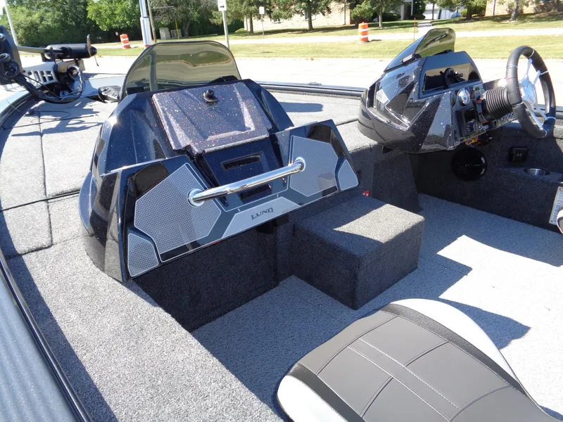 Slide: The Image of 2025 Lund 1875 Pro-V Bass XS boat interior with modern dashboard and seating. - 11