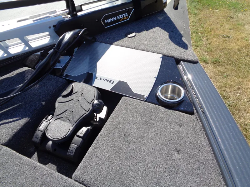Slide: The Image of 2025 Lund 1875 Pro-V Bass XS boat deck with Minn Kota trolling motor pedal. - 17