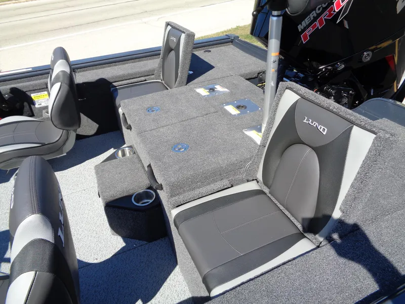 Slide: The Image of 2025 Lund 1875 Pro-V Bass XS boat interior with gray seating and storage compartments. - 21