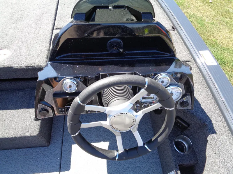 Slide: The Image of Steering console of 2025 Lund 1875 Pro-V Bass XS boat with modern controls. - 22