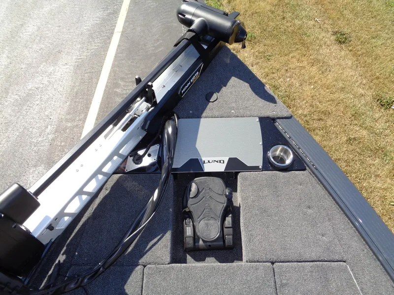 Slide: The Image of 2025 Lund 1875 Pro-V Bass XS boat deck with trolling motor and foot pedal. - 25