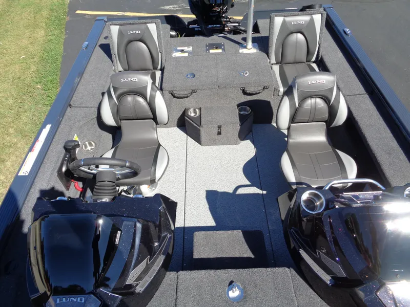 Slide: The Image of 2025 Lund 1875 Pro-V Bass XS boat interior with four seats and steering console. - 26