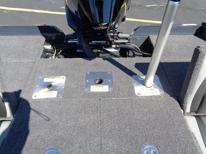 Slide: The Image of 2025 Lund 1875 Pro-V Bass XS boat deck with motor and seating mounts. - 27