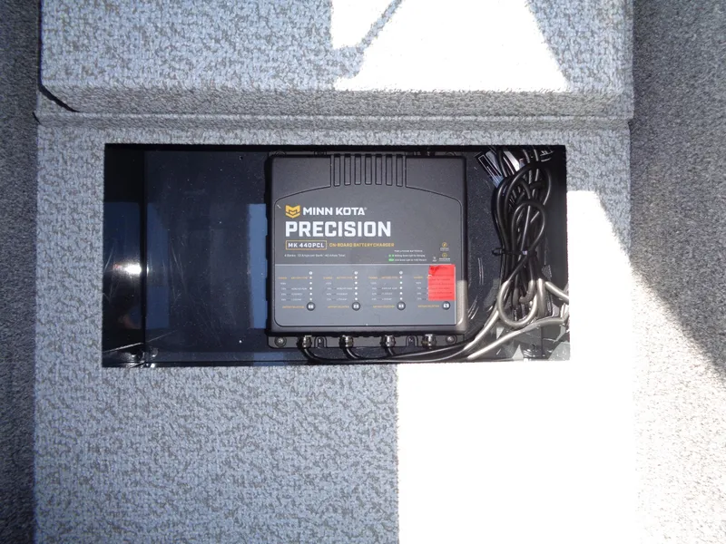 Slide: The Image of Minn Kota Precision charger installed in 2025 Lund 1875 Pro-V Bass XS boat. - 31