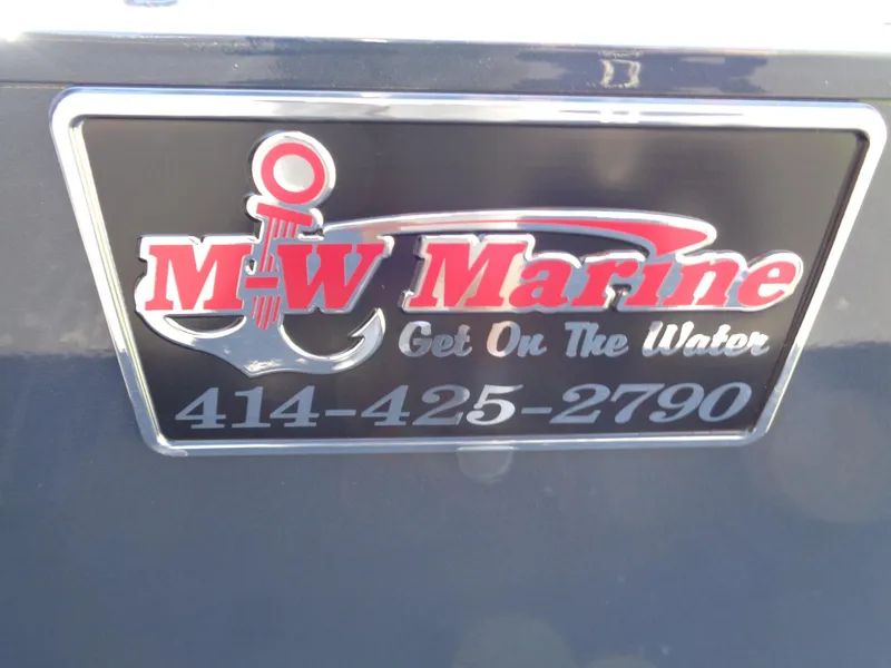 Slide: The Image of Sticker on a 2025 Lund 1875 Pro-V Bass XS, featuring M-W Marine contact details. - 33