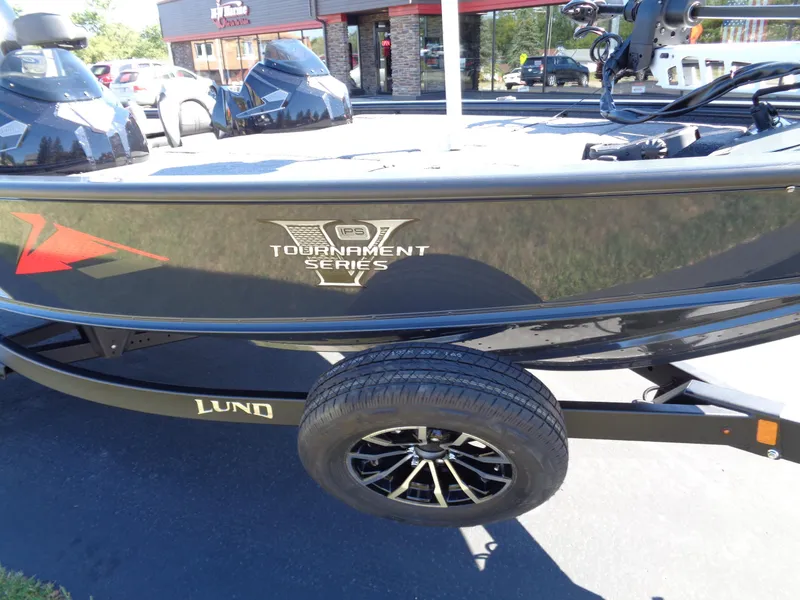 Slide: The Image of 2025 Lund 1875 Pro-V Bass XS boat, Tournament Series, on trailer in parking lot. - 5