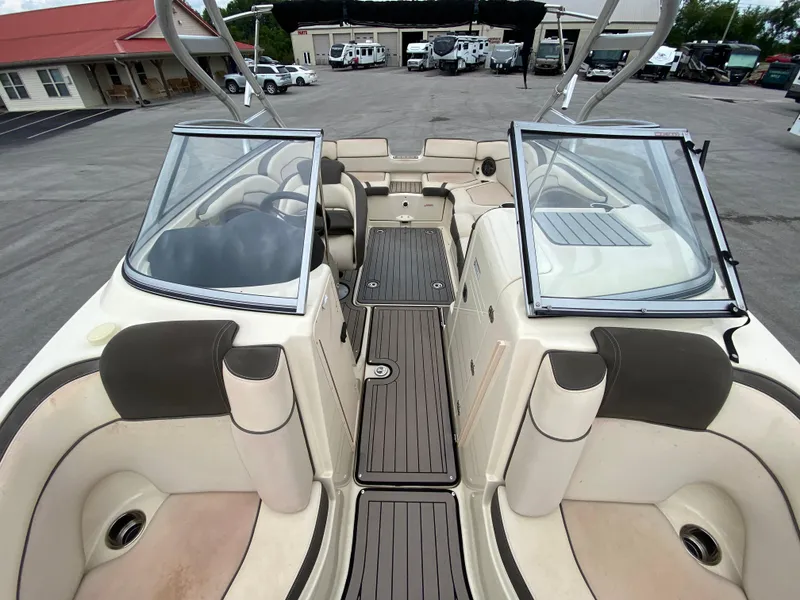 Slide: The Image of 2014 Yamaha Boats 242 Limited S interior with open windshield and seating area. - 10