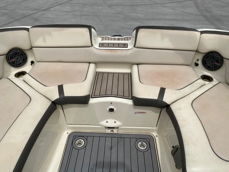 Slide: The Image of 2014 Yamaha Boats 242 Limited S interior seating area with speakers and storage compartments. - 20