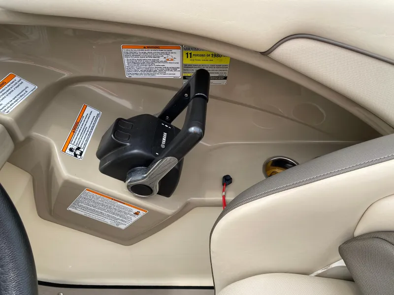 Slide: The Image of 2014 Yamaha Boats 242 Limited S throttle control and interior details. - 23