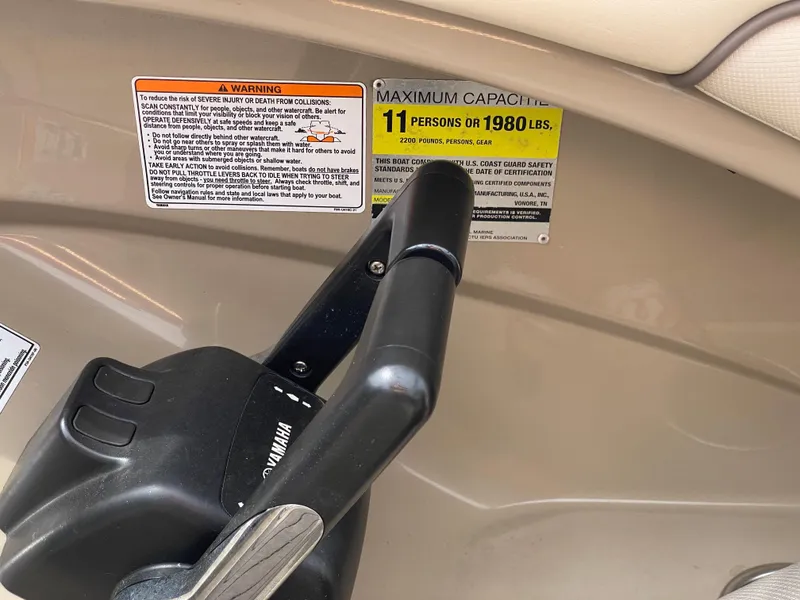 Slide: The Image of Throttle control and capacity warning on 2014 Yamaha Boats 242 Limited S, 11 persons or 1980 lbs. - 24