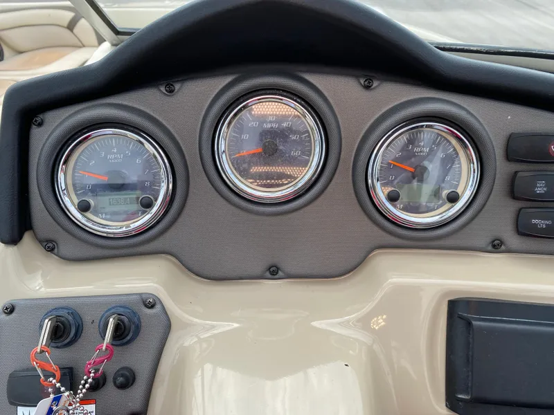 Slide: The Image of Dashboard of 2014 Yamaha Boats 242 Limited S with gauges and ignition keys. - 27